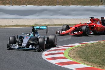 Nico Rosberg and Scuderia Ferrari SF15-T– Sebastian Vettel. Sunday 10th May 2015, F1 Spanish GP Formula 1 Race, Circuit de Barcelona-Catalunya, Spain. Digital Ref: 1265LB1D0354