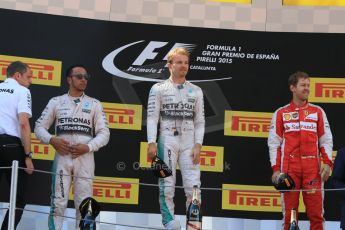 World © Octane Photographic Ltd. Mercedes AMG Petronas F1 W06 Hybrid – Nico Rosberg (1st) and Lewis Hamilton (2nd) and Scuderia Ferrari SF15-T– Sebastian Vettel (3rd). Sunday 10th May 2015, F1 Spanish GP Formula 1 Race podium, Circuit de Barcelona-Catalunya, Spain. Digital Ref: 1266CB7D0670