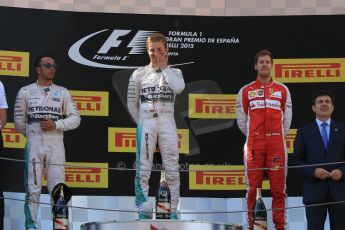 World © Octane Photographic Ltd. Mercedes AMG Petronas F1 W06 Hybrid – Nico Rosberg (1st) and Lewis Hamilton (2nd) and Scuderia Ferrari SF15-T– Sebastian Vettel (3rd). Sunday 10th May 2015, F1 Spanish GP Formula 1 Race podium, Circuit de Barcelona-Catalunya, Spain. Digital Ref: 1266CB7D0687