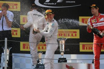 World © Octane Photographic Ltd. Mercedes AMG Petronas F1 W06 Hybrid – Nico Rosberg (1st) and Lewis Hamilton (2nd) and Scuderia Ferrari SF15-T– Sebastian Vettel (3rd). Sunday 10th May 2015, F1 Spanish GP Formula 1 Race podium, Circuit de Barcelona-Catalunya, Spain. Digital Ref: