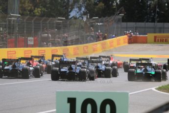 World © Octane Photographic Ltd. Saturday 9th May 2015. The pack safely bunches into turn 1. GP2 Race 1 – Circuit de Barcelona–Catalunya. Spain. Digital Ref: