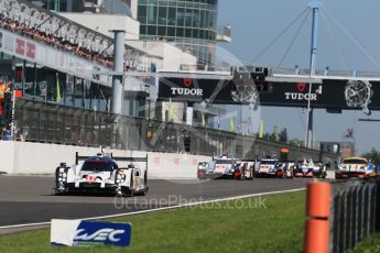 World © Octane Photographic Ltd. FIA World Endurance Championship (WEC), 6 Hours of Nurburgring , Germany - Race, Sunday 30th August 2015. Porsche Team – Porsche 919 Hybrid - LMP1 - Timo Bernhard, Mark Webber and Brendon Hartley ahead of the Audi Sport Team Joest- Audi R18 e-tron Quatrros of Oliver Jarvis, Lucas di Grassi and Loic Duval and Andre Lotterer, Benoit Treluyer and Marcel Fassler. Digital Ref : 1398LB1D7125
