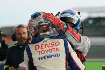 World © Octane Photographic Ltd. FIA World Endurance Championship (WEC), 6 Hours of Silverstone Race - Podium, UK, Sunday 12th April 2015. 1st Place, Audi R18 e-tron quattro - Marcel FASSLER, 3rd Place, Toyota TS040 Hybrid, Sebastien BUEMI. Digital Ref : 1227LW1L1946