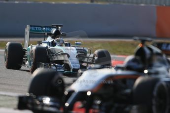 Lewis Hamilton behind Sahara Force India VJM07 – Sergio Perez. Friday 20th February 2015, F1 Winter testing, Circuit de Catalunya, Barcelona, Spain, Day 2. Digital Ref : 1188LB1D7570