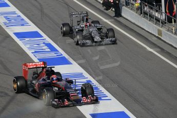 World © Octane Photographic Ltd. Scuderia Toro Rosso STR10 – Max Verstappen and Infiniti Red Bull Racing RB11 – Daniil Kvyat released at the same time into the pitlane. Saturday 21st February 2015, F1 Winter testing, Circuit de Barcelona Catalunya, Spain, Day 3. Digital Ref: 1190CB1L8605