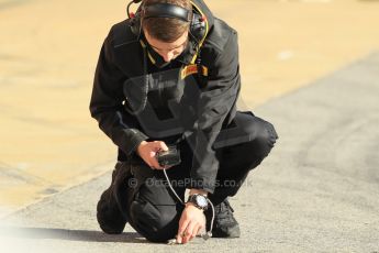 World © Octane Photographic Ltd. Pirelli tyre tech checking the track temperature. Sunday 22nd Sunday 22nd February 2015, F1 Winter test #2, Circuit de Barcelona Catalunya, Spain, Day 4. Digital Ref: 1191CB1L9100