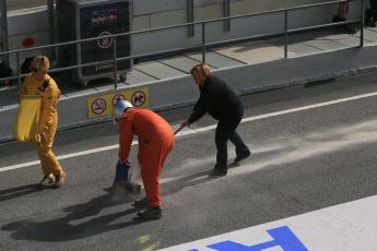 World © Octane Photographic Ltd. Marshals putting down sand after someone leaves oil (?). Saturday 28th February 2015, F1 Winter test #3, Circuit de Barcelona-Catalunya, Spain Test 2 Day 3. Digital Ref: 1194lb1d3268