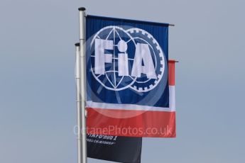 World © Octane Photographic Ltd. FIA Formula 1 flag with the Austrian flag. Thursday 30th June 2016, F1 Austrian GP Pit Lane, Red Bull Ring, Spielberg, Austria. Digital Ref : 1594LB1D0210