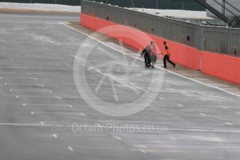 World © Octane Photographic Ltd. Wooden beam being cleared from track after falling from the start line overhead gantry. Tuesday 12th July 2016, F1 In-season testing, Silverstone UK. Digital Ref : 1618LB1D7851