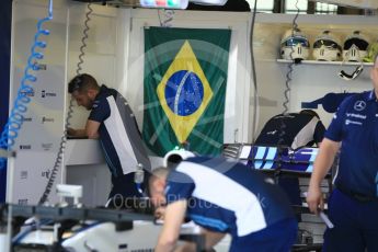 World © Octane Photographic Ltd. Williams Martini Racing, Williams Mercedes FW38 – Felipe Massa' s car being worked on with Brazilian flag in the background. Thursday 24th November 2016, F1 Abu Dhabi GP - Pitlane, Yas Marina circuit, Abu Dhabi. Digital Ref :