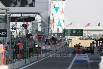 World © Octane Photographic Ltd. Ferrari heading out the pitlane at the start of the session. Friday 25th November 2016, F1 Abu Dhabi GP - Practice 1, Yas Marina circuit, Abu Dhabi. Digital Ref :