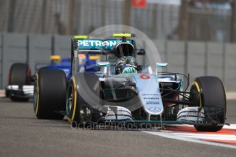 World © Octane Photographic Ltd. Mercedes AMG Petronas W07 Hybrid – Nico Rosberg and Sauber F1 Team C35 – Felipe Nasr. Friday 25th November 2016, F1 Abu Dhabi GP - Practice 2. Yas Marina circuit, Abu Dhabi. Digital Ref :