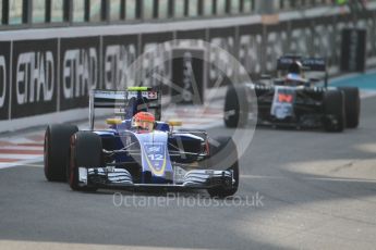 World © Octane Photographic Ltd. Sauber F1 Team C35 – Felipe Nasr and McLaren Honda MP4-31 – Fernando Alonso. Saturday 26th November 2016, F1 Abu Dhabi GP - Practice 3, Yas Marina circuit, Abu Dhabi. Digital Ref :