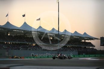 World © Octane Photographic Ltd. Scuderia Toro Rosso STR11 – Daniil Kvyat and Renault Sport F1 Team RS16 - Kevin Magnussen. Saturday 26th November 2016, F1 Abu Dhabi GP - Qualifying, Yas Marina circuit, Abu Dhabi. Digital Ref :