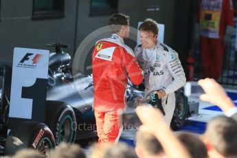 World © Octane Photographic Ltd. Scuderia Ferrari – Sebastian Vettel and Mercedes AMG Petronas – Nico Rosberg. Sunday 20th March 2016, F1 Australian GP Race – Parc Ferme, Melbourne, Albert Park, Australia. Digital Ref : 1525LB1D7626