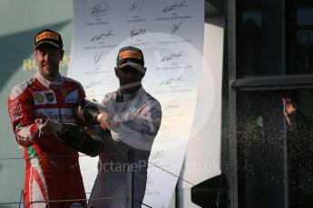 World © Octane Photographic Ltd. Mercedes AMG Petronas – Lewis Hamilton and Scuderia Ferrari – Sebastian Vettel. Sunday 20th March 2016, F1 Australian GP Race - Podium, Melbourne, Albert Park, Australia. Digital Ref : 1525LB1D8059