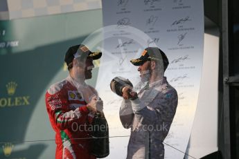 World © Octane Photographic Ltd. Mercedes AMG Petronas – Lewis Hamilton and Scuderia Ferrari – Sebastian Vettel. Sunday 20th March 2016, F1 Australian GP Race - Podium, Melbourne, Albert Park, Australia. Digital Ref : 1525LB1D8069