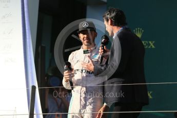 World © Octane Photographic Ltd. Mercedes AMG Petronas – Lewis Hamilton and Mark Webber. Sunday 20th March 2016, F1 Australian GP Race - Podium, Melbourne, Albert Park, Australia. Digital Ref : 1525LB1D8245