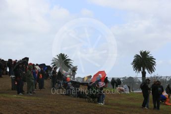 World © Octane Photographic Ltd. Fans watch in the rain. Friday 18th March 2016, F1 Australian GP Practice 1, Melbourne, Albert Park, Australia. Digital Ref : 1516LB5D1246