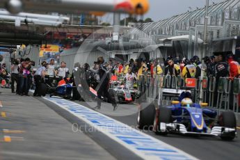 World © Octane Photographic Ltd. Haas F1 Team VF-16 – Romain Grosjean and Manor Racing MRT05 – Rio Haryanto. Saturday 19th March 2016, F1 Australian GP Practice 3, Melbourne, Albert Park, Australia. Digital Ref : 1519LB1D4651