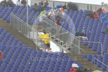 World © Octane Photographic Ltd. Fans in the grandstands during the thunderstorm. Friday 1st July 2016, F1 Austrian GP Practice 2, Red Bull Ring, Spielberg, Austria. Digital Ref : 1600CB1D2488