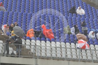World © Octane Photographic Ltd. Fans in the grandstands during the thunderstorm. Friday 1st July 2016, F1 Austrian GP Practice 2, Red Bull Ring, Spielberg, Austria. Digital Ref : 1600CB1D2493
