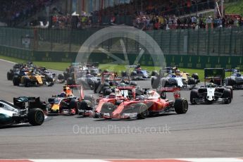 World © Octane Photographic Ltd. Scuderia Ferrari SF16-H – Sebastian Vettel and team mate Kimi Raikkonen come together at Turn 1. Sunday 28th August 2016, F1 Belgian GP Race, Spa-Francorchamps, Belgium. Digital Ref : 1692LB1D2503