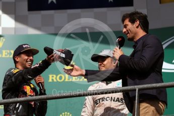World © Octane Photographic Ltd. Red Bull Racing – Daniel Ricciardo offers champagne from his race boot to Mark Webber. Sunday 28th August 2016, F1 Belgian GP Race Podium, Spa-Francorchamps, Belgium. Digital Ref : 1693LB1D3388