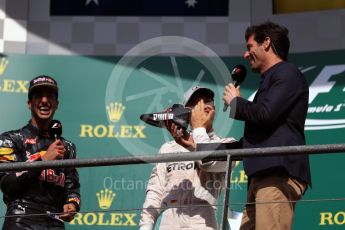 World © Octane Photographic Ltd. Red Bull Racing – Daniel Ricciardo offers champagne from his race boot to Mark Webber. Sunday 28th August 2016, F1 Belgian GP Race Podium, Spa-Francorchamps, Belgium. Digital Ref : 1693LB1D3394