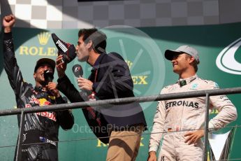 World © Octane Photographic Ltd. Red Bull Racing – Daniel Ricciardo offers champagne from his race boot to Mark Webber. Sunday 28th August 2016, F1 Belgian GP Race Podium, Spa-Francorchamps, Belgium. Digital Ref : 1693LB1D3400