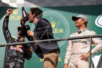World © Octane Photographic Ltd. Red Bull Racing – Daniel Ricciardo offers champagne from his race boot to Mark Webber. Sunday 28th August 2016, F1 Belgian GP Race Podium, Spa-Francorchamps, Belgium. Digital Ref : 1693LB1D3416
