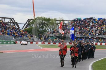World © Octane Photographic Ltd. RCMP lead the Armed Forces march past. Sunday 12th June 2016, F1 Canadian GP Grid, Circuit Gilles Villeneuve, Montreal, Canada. Digital Ref :1591LB1D3241