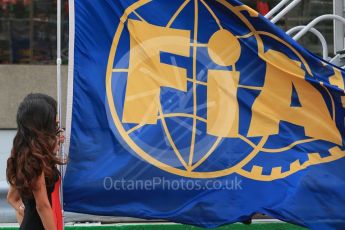 World © Octane Photographic Ltd. Grid girl with FIA flag. Sunday 12th June 2016, F1 Canadian GP Grid, Circuit Gilles Villeneuve, Montreal, Canada. Digital Ref :1591LB1D3253