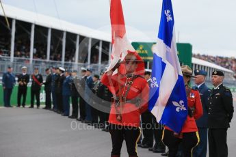World © Octane Photographic Ltd. RCMP lead the Armed Forces march past. Sunday 12th June 2016, F1 Canadian GP Grid, Circuit Gilles Villeneuve, Montreal, Canada. Digital Ref :1591LB1D3352