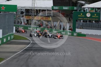 World © Octane Photographic Ltd. Scuderia Ferrari SF16-H – Sebastian Vettel takes the lead from the start. Sunday 12th June 2016, F1 Canadian GP Race, Circuit Gilles Villeneuve, Montreal, Canada. Digital Ref :1592LB1D3399