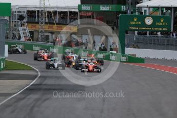 World © Octane Photographic Ltd. Scuderia Ferrari SF16-H – Sebastian Vettel takes the lead from the start. Sunday 12th June 2016, F1 Canadian GP Race, Circuit Gilles Villeneuve, Montreal, Canada. Digital Ref :1592LB1D3403