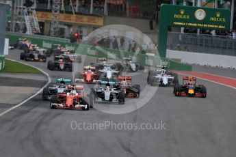 World © Octane Photographic Ltd. Scuderia Ferrari SF16-H – Sebastian Vettel ahead of Mercedes AMG Petronas W07 Hybrid – Nico Rosberg and Lewis Hamilton. Sunday 12th June 2016, F1 Canadian GP Race, Circuit Gilles Villeneuve, Montreal, Canada. Digital Ref :1592LB1D3414