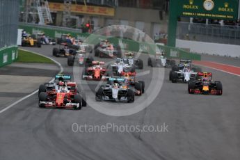 World © Octane Photographic Ltd. Scuderia Ferrari SF16-H – Sebastian Vettel ahead of Mercedes AMG Petronas W07 Hybrid – Nico Rosberg and Lewis Hamilton. Sunday 12th June 2016, F1 Canadian GP Race, Circuit Gilles Villeneuve, Montreal, Canada. Digital Ref :1592LB1D3417