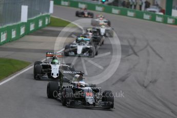 World © Octane Photographic Ltd. McLaren Honda MP4-31 – Fernando Alonso and Sahara Force India VJM09 - Nico Hulkenberg. Sunday 12th June 2016, F1 Canadian GP Race, Circuit Gilles Villeneuve, Montreal, Canada. Digital Ref : 1592LB1D3500