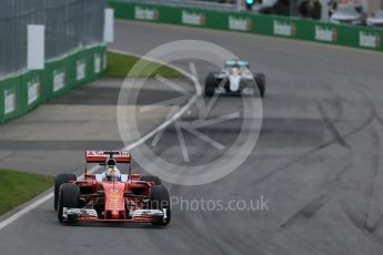 World © Octane Photographic Ltd. Scuderia Ferrari SF16-H – Sebastian Vettel ahead of Mercedes AMG Petronas W07 Hybrid – Lewis Hamilton on lap 2. Sunday 12th June 2016, F1 Canadian GP Race, Circuit Gilles Villeneuve, Montreal, Canada. Digital Ref :1592LB1D3477