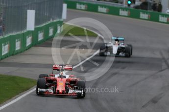 World © Octane Photographic Ltd. Scuderia Ferrari SF16-H – Sebastian Vettel ahead of Mercedes AMG Petronas W07 Hybrid – Lewis Hamilton on lap 2. Sunday 12th June 2016, F1 Canadian GP Race, Circuit Gilles Villeneuve, Montreal, Canada. Digital Ref :1592LB1D3477