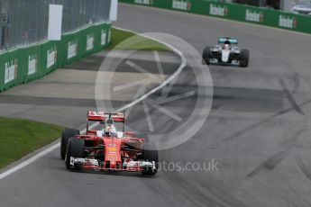 World © Octane Photographic Ltd. Scuderia Ferrari SF16-H – Sebastian Vettel. Sunday 12th June 2016, F1 Canadian GP Race, Circuit Gilles Villeneuve, Montreal, Canada. Digital Ref :1592LB1D3801