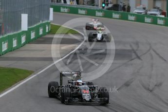World © Octane Photographic Ltd. McLaren Honda MP4-31 – Fernando Alonso and Sahara Force India VJM09 - Sergio Perez. Sunday 12th June 2016, F1 Canadian GP Race, Circuit Gilles Villeneuve, Montreal, Canada. Digital Ref :1592LB1D3890