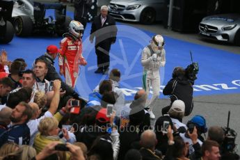 World © Octane Photographic Ltd. Mercedes AMG Petronas – Lewis Hamilton (1st) and Scuderia Ferrari – Sebastian Vettel (2nd). Sunday 12th June 2016, F1 Canadian GP Parc Ferme, Circuit Gilles Villeneuve, Montreal, Canada. Digital Ref :1593LB1D4207