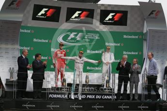 World © Octane Photographic Ltd. Mercedes AMG Petronas – Lewis Hamilton (1st), Scuderia Ferrari – Sebastian Vettel (2nd) and Williams Martini Racing, – Valtteri Bottas (3rd) with Mercedes AMG Petronas Head of Electronics – Evan Short (Constructors’ Trophy). Sunday 12th June 2016, F1 Canadian GP Podium, Circuit Gilles Villeneuve, Montreal, Canada. Digital Ref :1593LB1D4392