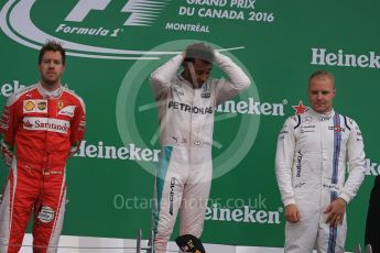 World © Octane Photographic Ltd. Mercedes AMG Petronas – Lewis Hamilton (1st), Scuderia Ferrari – Sebastian Vettel (2nd) and Williams Martini Racing, – Valtteri Bottas (3rd). Sunday 12th June 2016, F1 Canadian GP Podium, Circuit Gilles Villeneuve, Montreal, Canada. Digital Ref :1593LB1D4414
