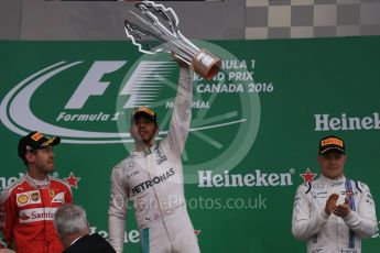 World © Octane Photographic Ltd. Mercedes AMG Petronas – Lewis Hamilton (1st), Scuderia Ferrari – Sebastian Vettel (2nd) and Williams Martini Racing, – Valtteri Bottas (3rd). Sunday 12th June 2016, F1 Canadian GP Podium, Circuit Gilles Villeneuve, Montreal, Canada. Digital Ref :1593LB1D4515