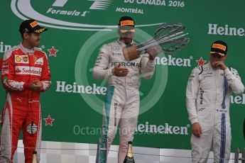 World © Octane Photographic Ltd. Mercedes AMG Petronas – Lewis Hamilton (1st), Scuderia Ferrari – Sebastian Vettel (2nd) and Williams Martini Racing, – Valtteri Bottas (3rd). Sunday 12th June 2016, F1 Canadian GP Podium, Circuit Gilles Villeneuve, Montreal, Canada. Digital Ref :1593LB1D4540