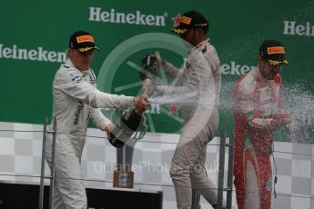 World © Octane Photographic Ltd. Mercedes AMG Petronas – Lewis Hamilton (1st), Scuderia Ferrari – Sebastian Vettel (2nd) and Williams Martini Racing, – Valtteri Bottas (3rd). Sunday 12th June 2016, F1 Canadian GP Podium, Circuit Gilles Villeneuve, Montreal, Canada. Digital Ref :1593LB1D4708