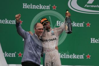 World © Octane Photographic Ltd. Mercedes AMG Petronas – Lewis Hamilton (1st) with Evan Short (Constructors’ Trophy). Sunday 12th June 2016, F1 Canadian GP Podium, Circuit Gilles Villeneuve, Montreal, Canada. Digital Ref :1593LB1D4767